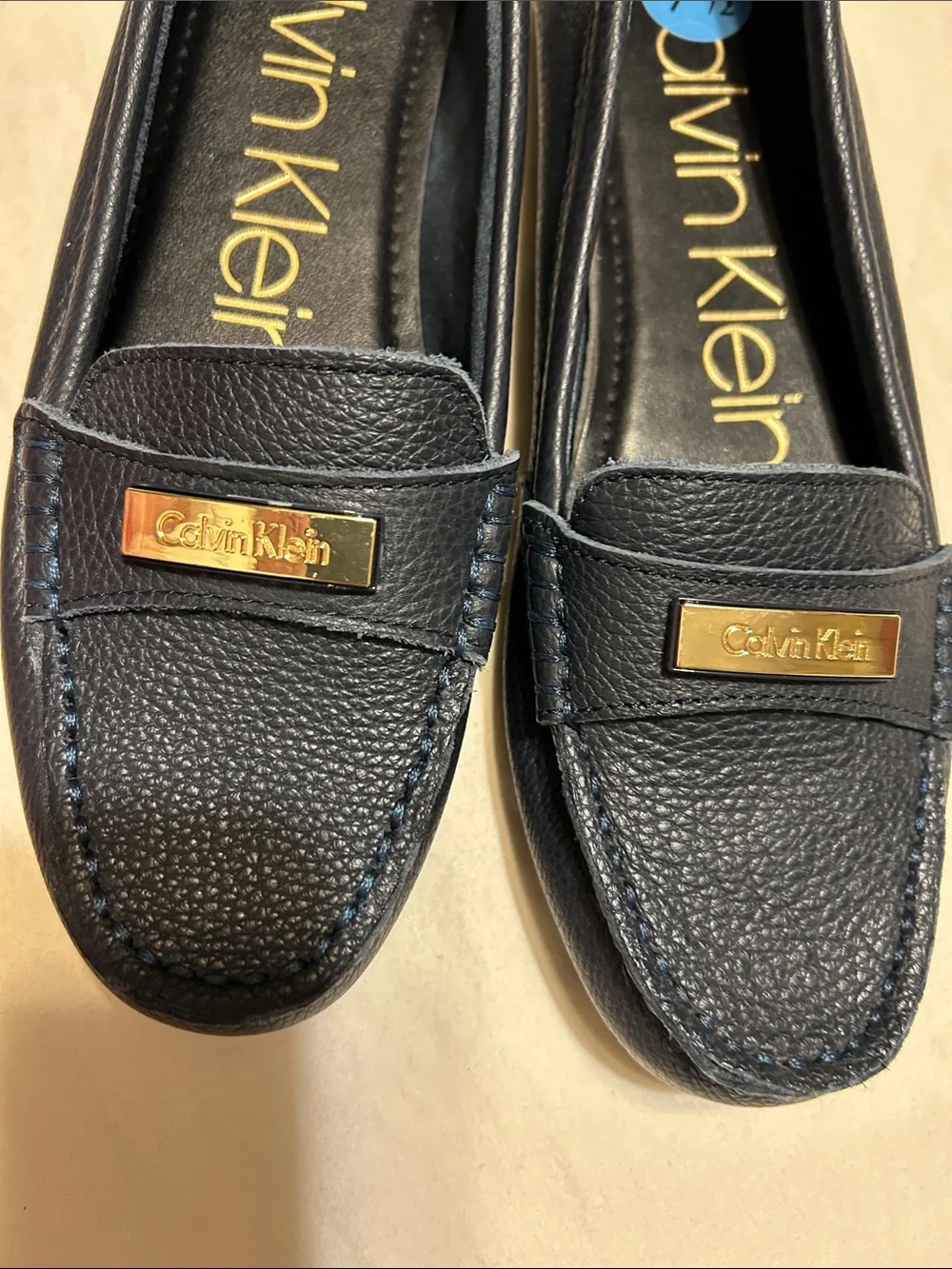 Calvin Klein Women's Navy Leather Moccasin Loafers with Gold Plaque